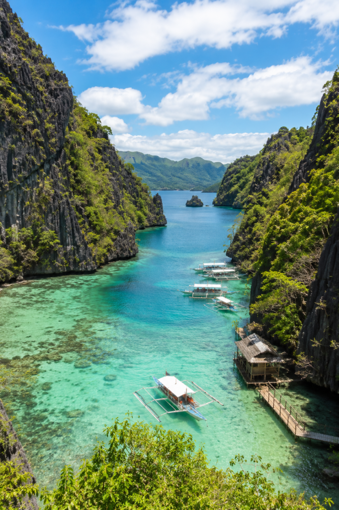 Turquoise lagoon surrounded by limestone cliffs in Palawan